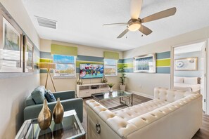 Loft area with large sofa and smart TV
