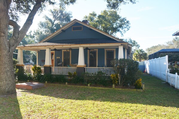 Bungalow , inviting front porch looking out on cobblestone streets