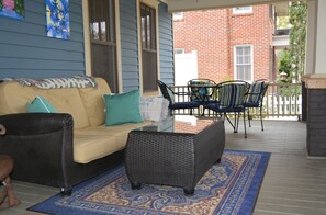 cozy front porch with ceiling fans