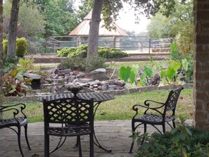 Gazebo sitting area overlooking koi pond