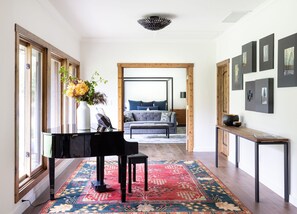 Musicians will enjoy the baby grand piano on the way to the primary bedroom.