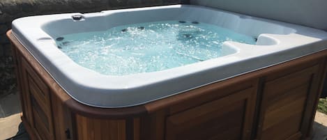 Enjoy a relaxing soak in the hot tub 