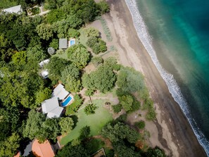 Aerial view of the house. It really is in front of the beach