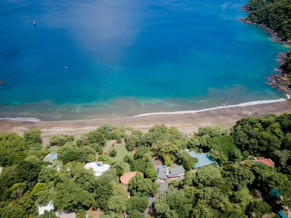 Aerial view of the house. It really is in front of the beach