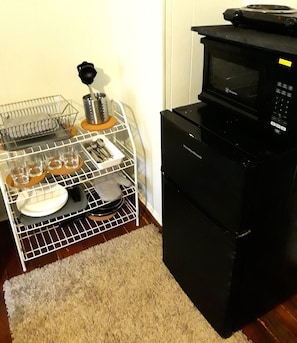 Minifridge, microwave, two burner hotplate, utensils, pans and glasses availabl