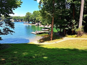 Enjoy a gently sloping lawn with easy access to the peaceful lake.