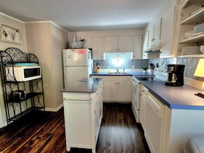 Cozy, well-organized kitchen for quick meals and gatherings.