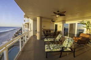 Oceanfront Balcony with a grill and dining for six.