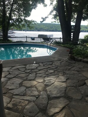 View from hot tub overlooking pool and lake