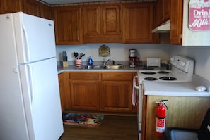 Fully equipped kitchen with lots of dishes  and pans for all of your meals.