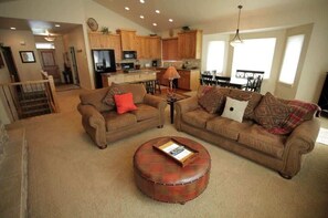 Great room with view to kitchen and dining table