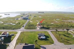 Aerial view of house and Swan Lake with Intracoastal in background