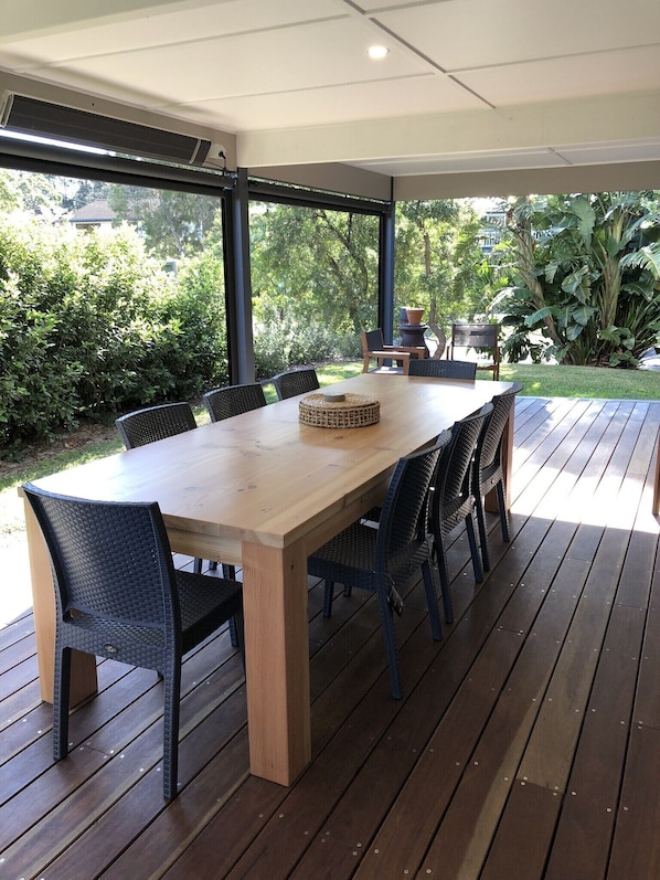 Undercover outdoor area with weatherproof blinds and heating. 
