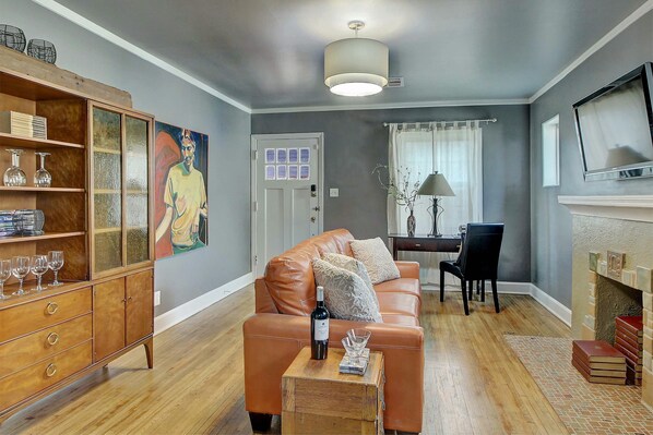 Full of light. Full of Art. Full of local Tulsa craftwork. The couch sleeps a +1