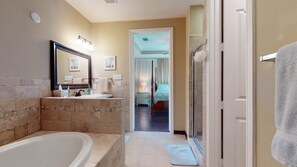 3rd floor primary bathroom with jacuzzi tub, shower and walk-in closet