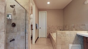 3rd floor primary bathroom with jacuzzi tub, shower and walk-in closet