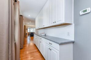 Buffet serving area between kitchen and dining room