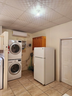 Washer and dryer, conveniently located in the suite.