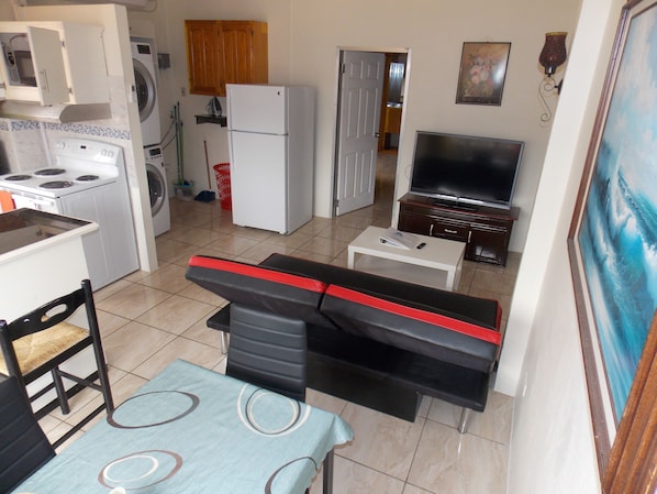 The great room includes Entertainment, Laundry, Kitchen and Dining room space.