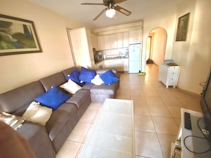 Living Area And Kitchen Viewed From The Patio Doors