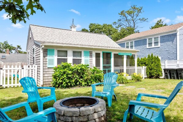 Welcome to Sunny Daze Cottage!  The perfect outdoor firepit spot is cozy, surrounded by nature, and offers a serene ambiance for roasting marshmallows and sharing stories.