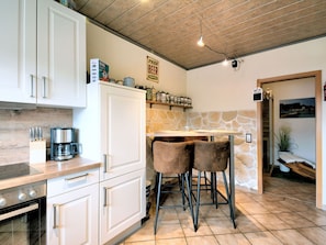 Cabinetry, Countertop, Wood, Kitchen Appliance, Lighting, Interior Design, Kitchen, Floor, Flooring, Kitchen Stove