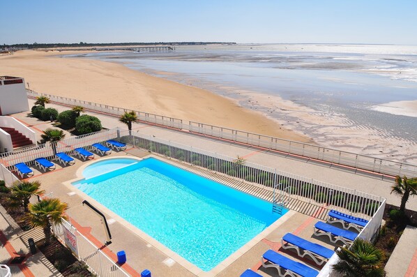 Dive into the gorgeous outdoor pool on a hot summer day.