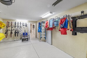 The garage contains beach chairs, coolers, umbrella, wagon and 4 bikes.  