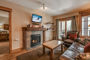 Living room with a cozy fireplace - Perfect for a snowy day in