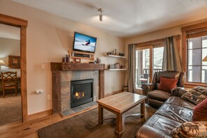 living room with a cozy fireplace