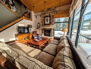 Fireplace, spacious couch, flat screen tv