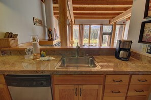 Kitchen with stainless granite counter tops