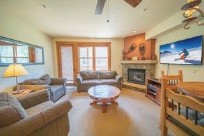Spacious living room with door to deck