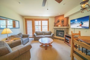 Spacious living room with door to deck