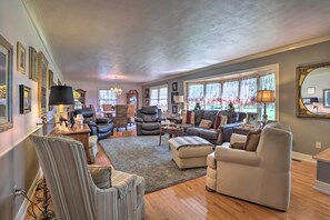 Bay windows pull the outdoors inside.