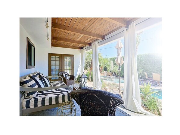 Lounge area that overlooks the pool