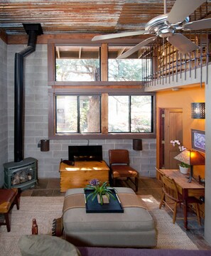 Living Room with a Vermont Gas Stove, Smart TV and Desk