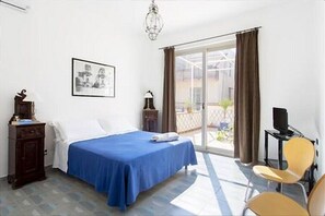 Master bedroom looks on the second terrace of the apartment