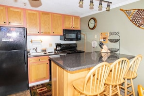 Remodeled kitchen is fully-equipped with pots, pans & utensils.