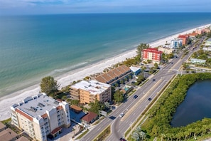Aerial shot of the beach and the building located on Indian Shor - Aerial shot of the beach and the building located on Indian Shores Beach