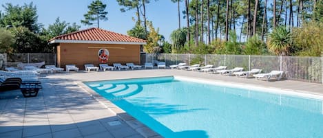 Lounge by the pool in the sunshine.