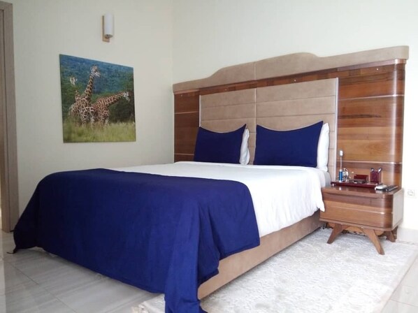 Bedroom with a blue theme that is used throughout the property.