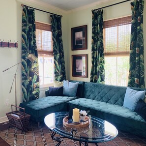 Daytime view of living room with convertible sectional that can sleep two.