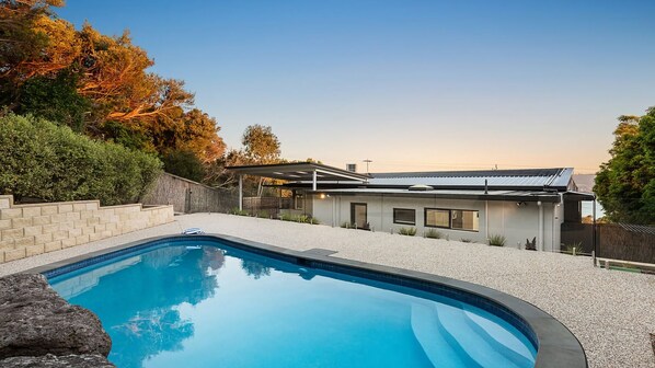 Ellerina solar-heated pool, complete with elegant landscaping and ample seating