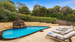 Ellerina Outdoor Pool, complete with elegant landscaping and ample seating