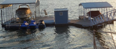 The dock, with slide, diving board, and open slip
