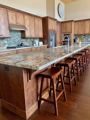 Butterflied granite slab - comfortably seats six stools with room to spare.  