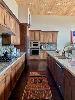 Custom cabinetry with soft close drawers and cabinets.  Generous prep area. 