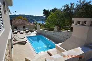 Swimming pool and lounge area - view on Rogac bay