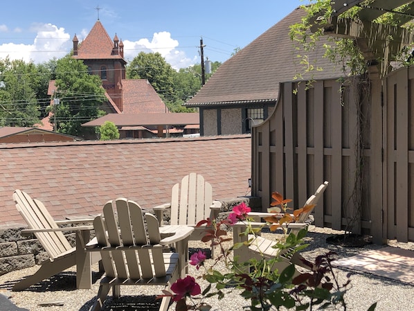 A private terrace overlooking The Cathedral of All Souls & Biltmore Estate prop.